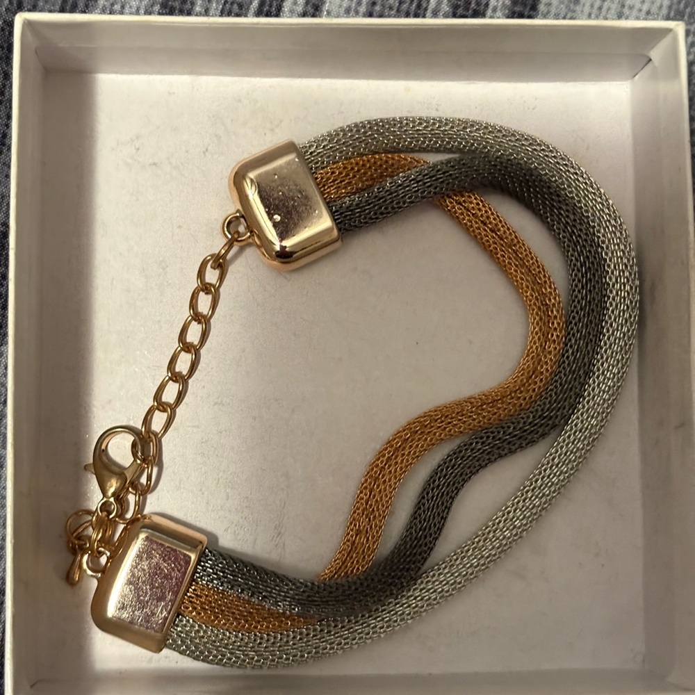 Radiant Gold and Silver Cuff Bracelet with Intricate Detailing